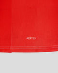 Close-up of the red jersey hem with white AERTEK branding