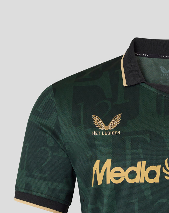 Detail of the collar and chest with black collar and beige trim, dark green pattern, and gold wing emblem with Het Legioen text.