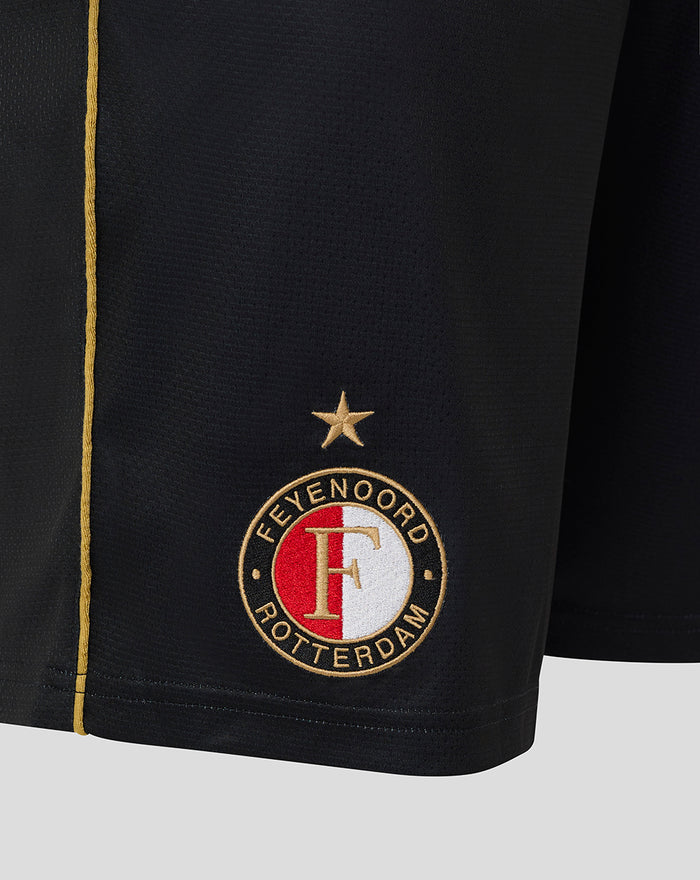 Close-up of the left leg bottom displaying the Feyenoord Rotterdam crest with a star above and the gold side stripe