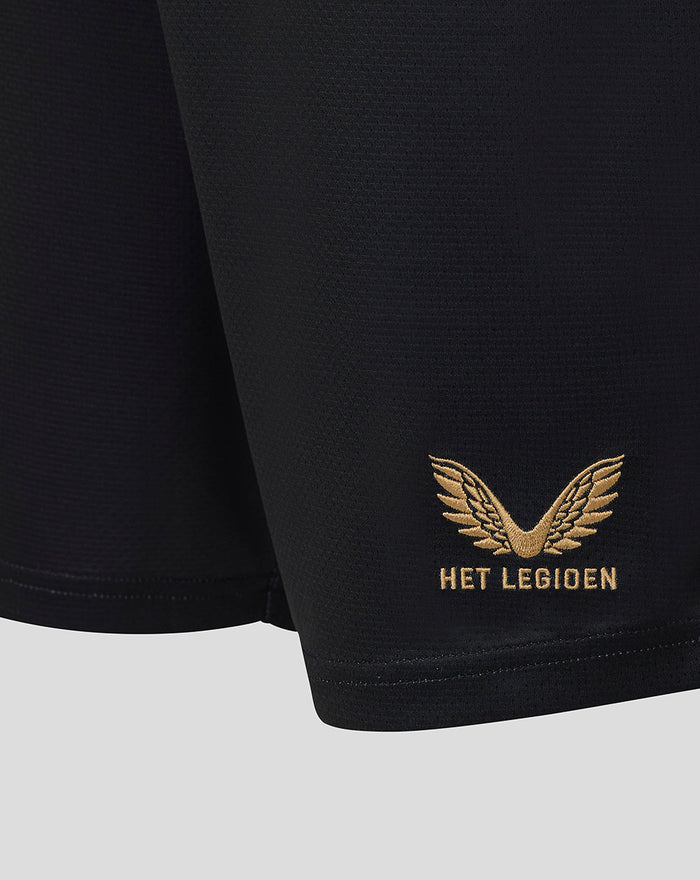 Close-up of black football shorts hem with gold Het Legioen wing embroidery