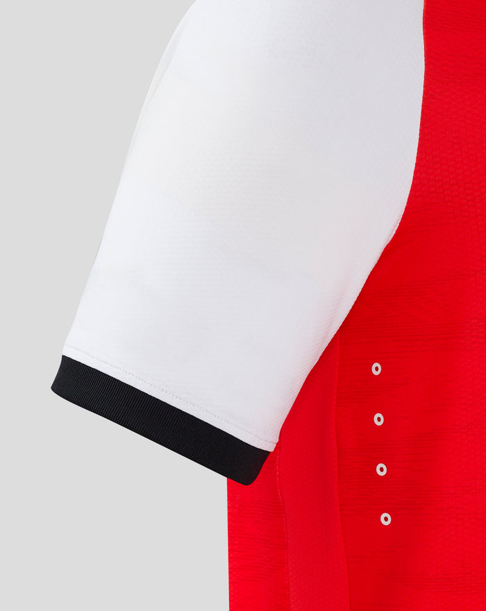 Close up of Feyenoord home shirt sleeve in white with a black cuff and red side panel.