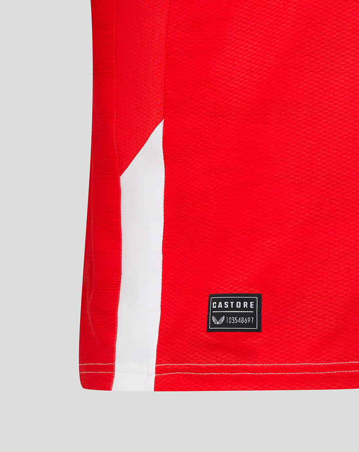 Lower portion of red Feyenoord Pro shirt with Castore brand patch near hem.