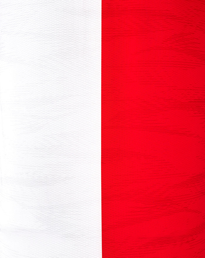 Close up of red jersey fabric with a vertical white panel and textured weave.