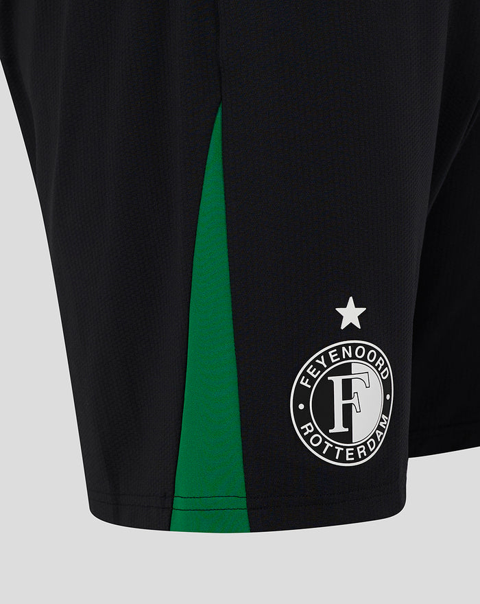 Close up of the lower leg of black Feyenoord Pro away shorts with a green side stripe and the Feyenoord crest