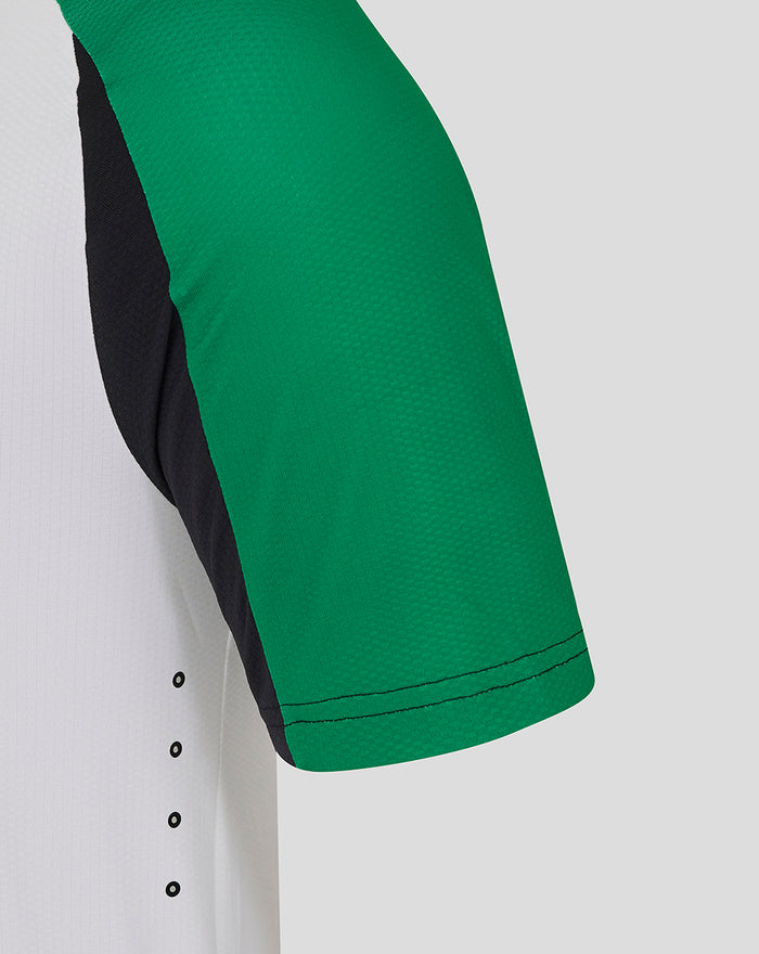 Close up of sleeve and side panel of Feyenoord Pro Derde Shirt showing green fabric and black underarm accents