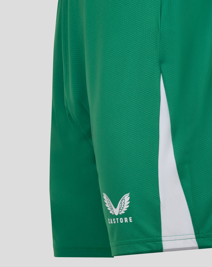 Close-up of green shorts showing the Castore branding and wing emblem