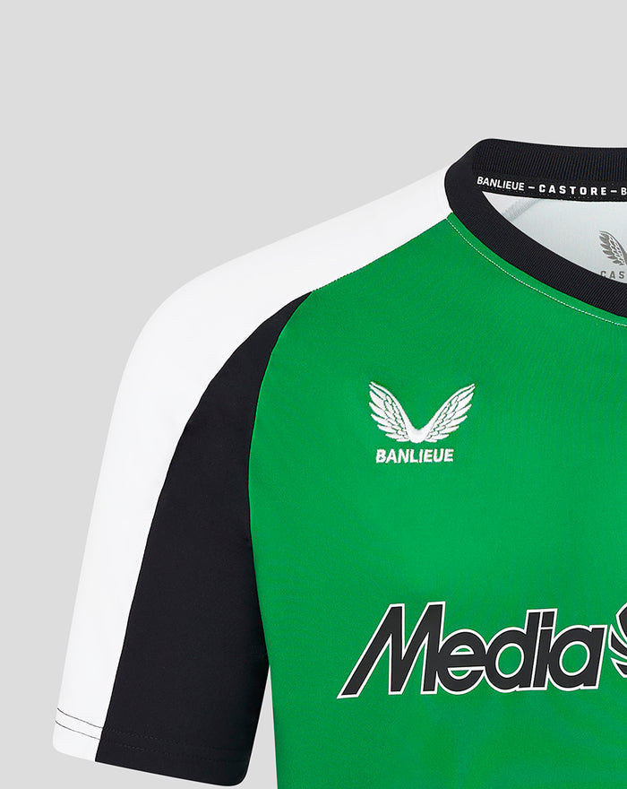 Close-up of the Feyenoord third shirt shoulder and chest with green panel crest and MediaMarkt sponsor graphic.