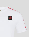 Close up of white Feyenoord T shirt showing red shoulder piping and crest patch on chest