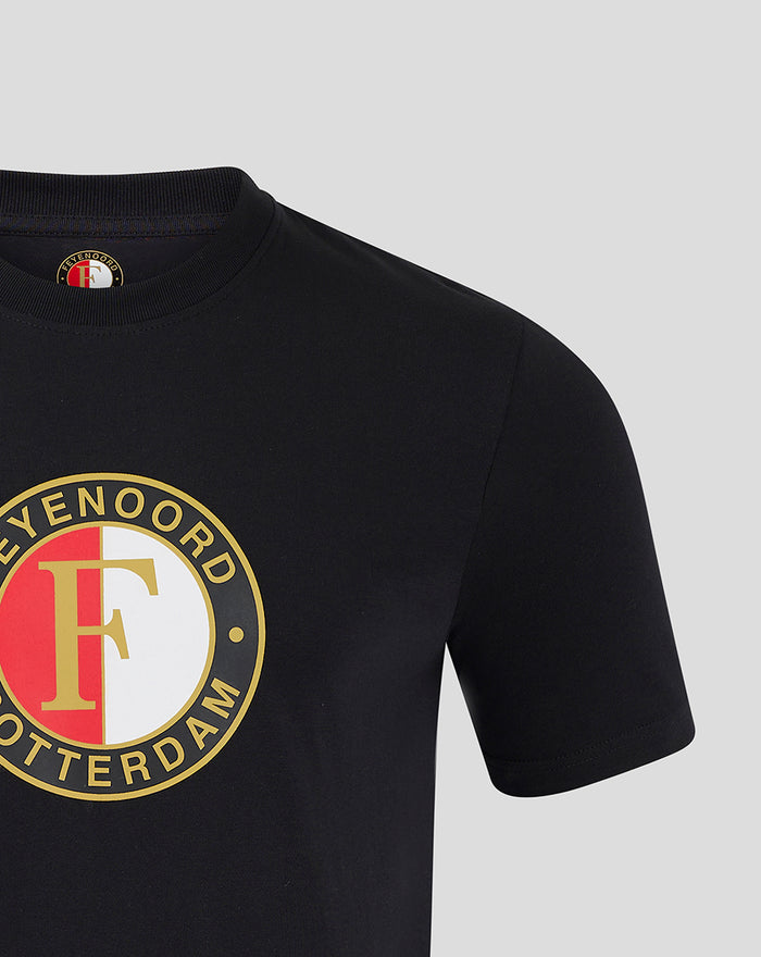 Close-up of the black T-shirt chest showing the round Feyenoord logo in gold red and white.