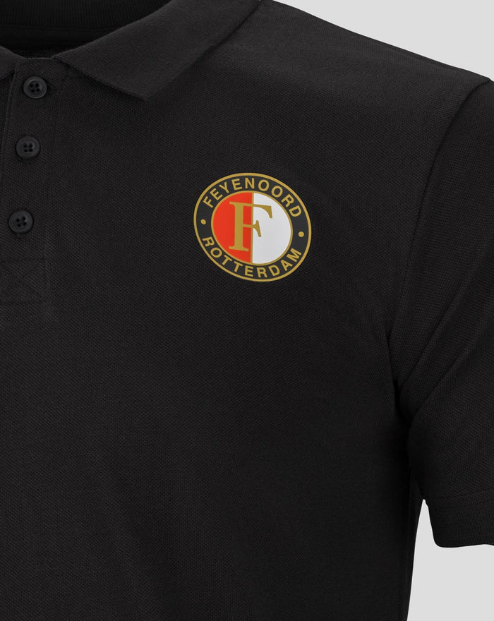Close-up of a black Feyenoord Core polo showing the left chest crest