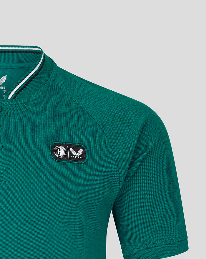 Teal polo with Feyenoord Castore crest patch on the left chest