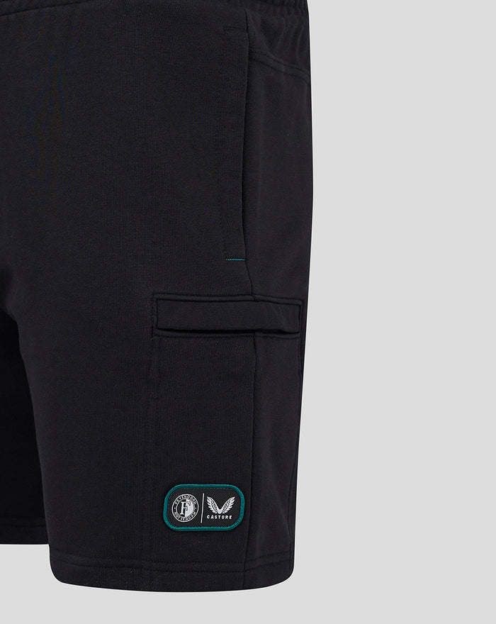 Lower leg detail of black shorts with a teal bordered patch featuring Feyenoord Castore logos