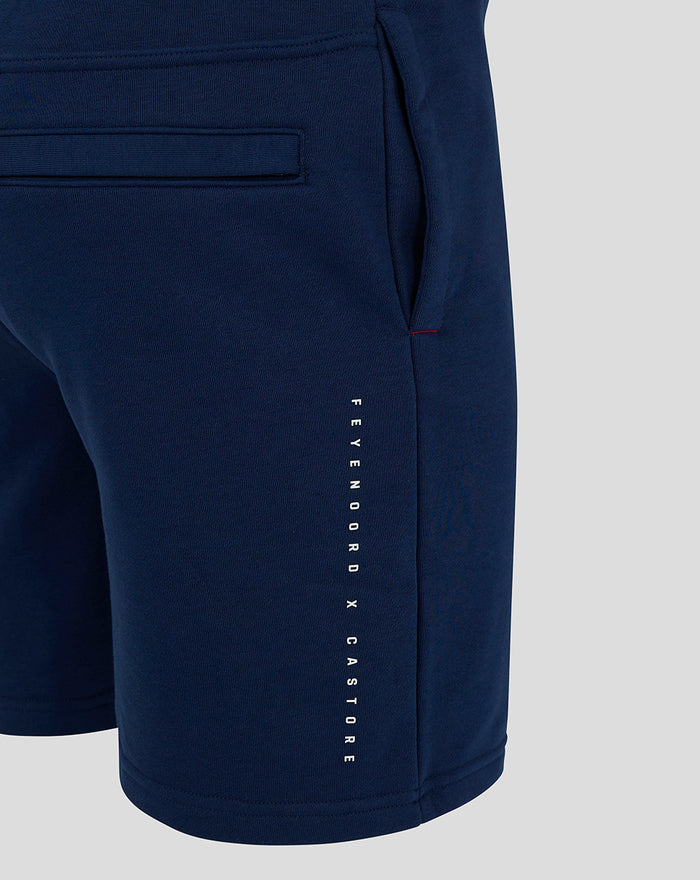 Close-up of navy Feyenoord x Castore shorts with vertical branding along the leg