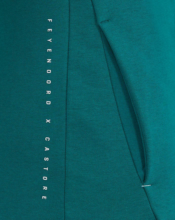 Teal Feyenoord x Castore fleece shirt vertical Feyenoord x Castore text along the side seam