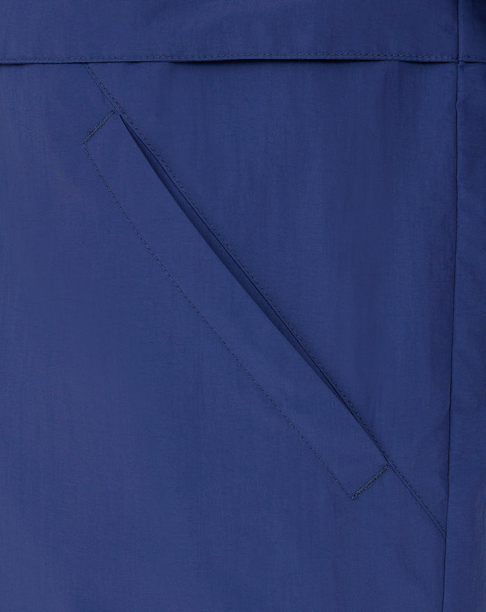 Diagonal pocket seam detail on blue Feyenoord Castore men's anorak