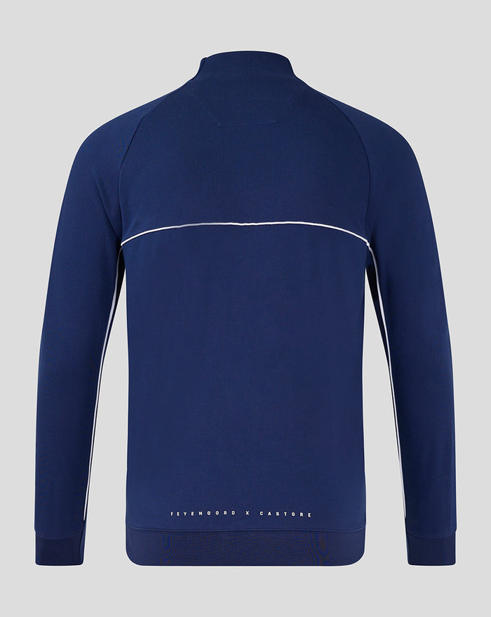 Back view of navy blue FEYENOORD x CASTORE training top showing white piping along the chest and the logo text at the hem.