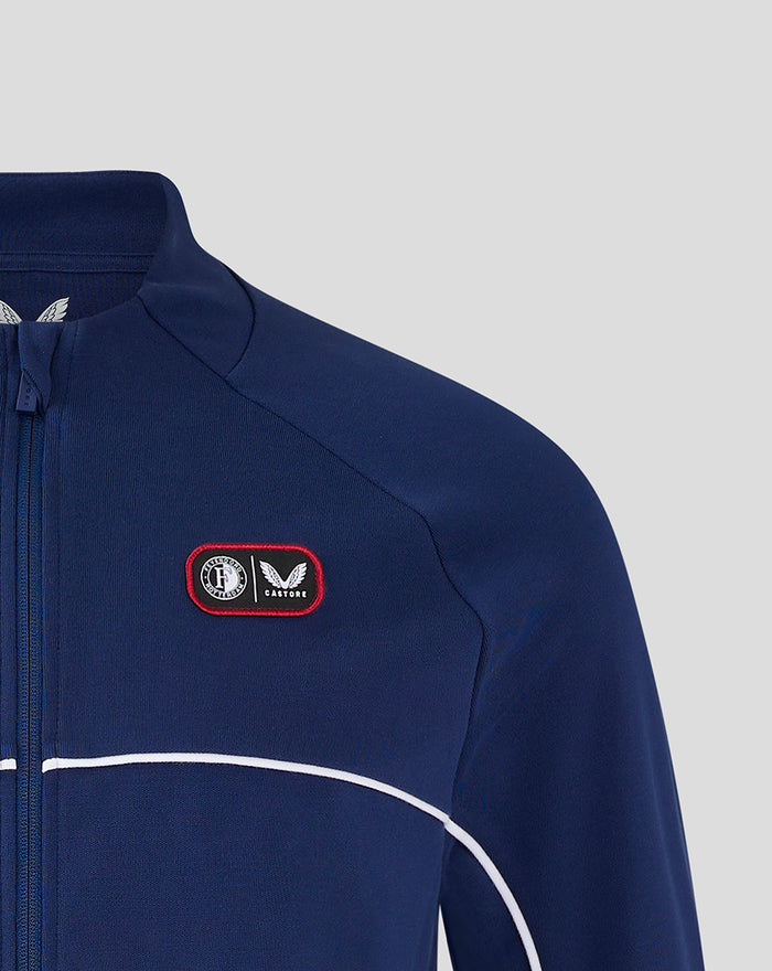 Blue training top with red bordered chest patch logo for Feyenoord Castore collaboration.