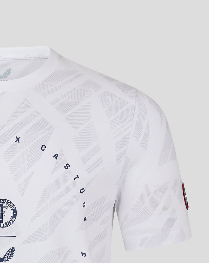Close up of white Feyenoord Castore T shirt with circular crest and diagonal CASTORE text on a geometric pattern