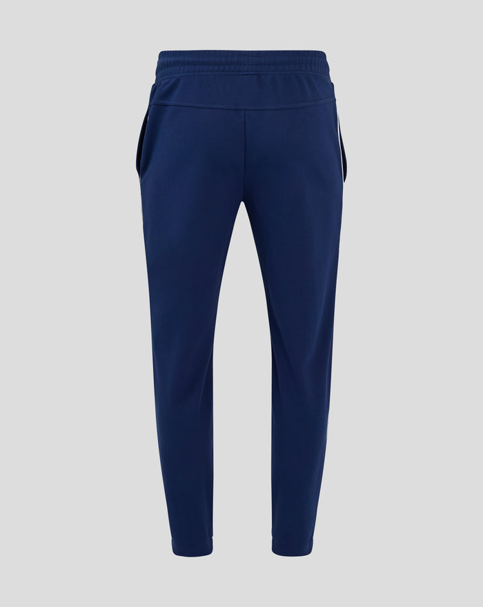 Back view of navy Feyenoord Castore men's training pants with white piping and badge