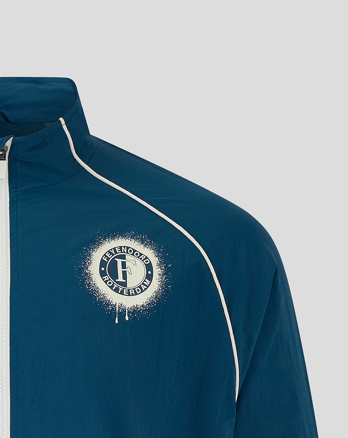Close up of blue Feyenoord training jacket showing the chest crest and white piping.