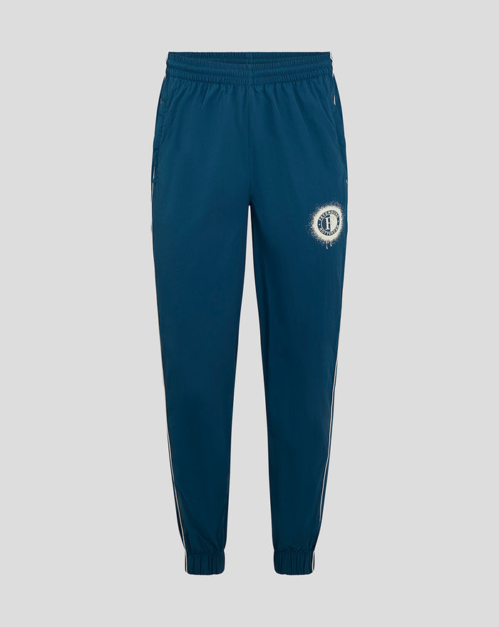 Blue Feyenoord contemporary training pants for men with a circular club badge on the left thigh