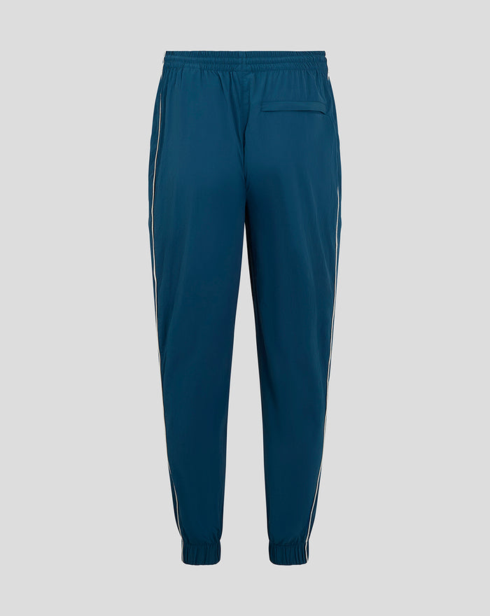 Back view of blue FEYENOORD contemporary training pants for men with white side piping and elastic cuffs