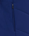 Close up of navy blue training jacket fabric with a vertical zipper detail