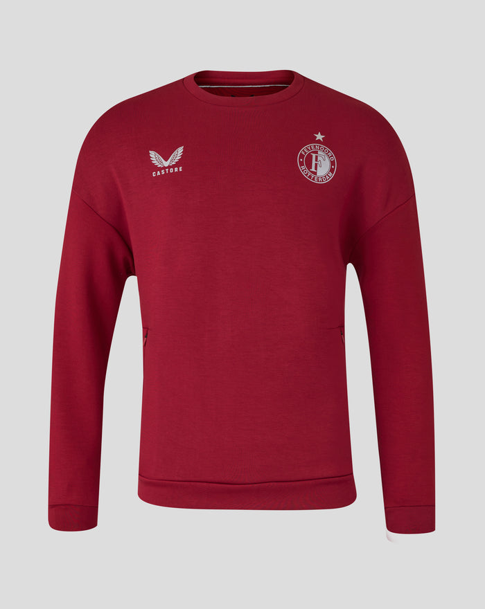 Voorkant van rode Feyenoord Travel crewneck sweater met Castore logo links en Feyenoord Rotterdam clubbadge rechts met ster erboven