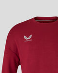 Close up of red Feyenoord Travel crewneck sweater highlighting collar detail and subtle logo
