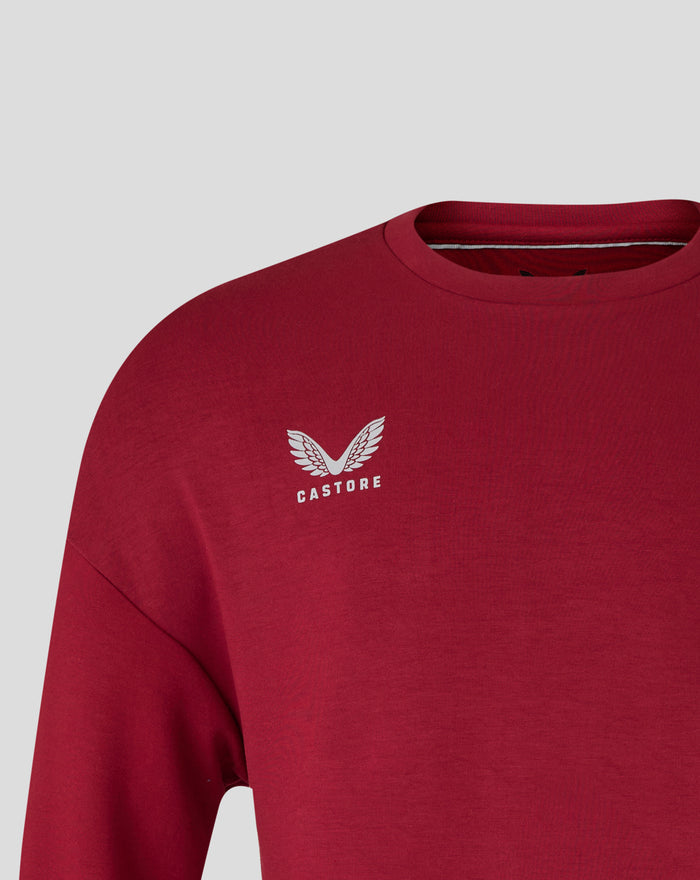 Close up of red Feyenoord Travel crewneck sweater highlighting collar detail and subtle logo