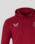 Close up of red hoodie chest showing Castore logo on left and Feyenoord crest on right.