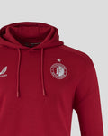 Front view of red Feyenoord travel hoodie with hood and a visible chest crest.