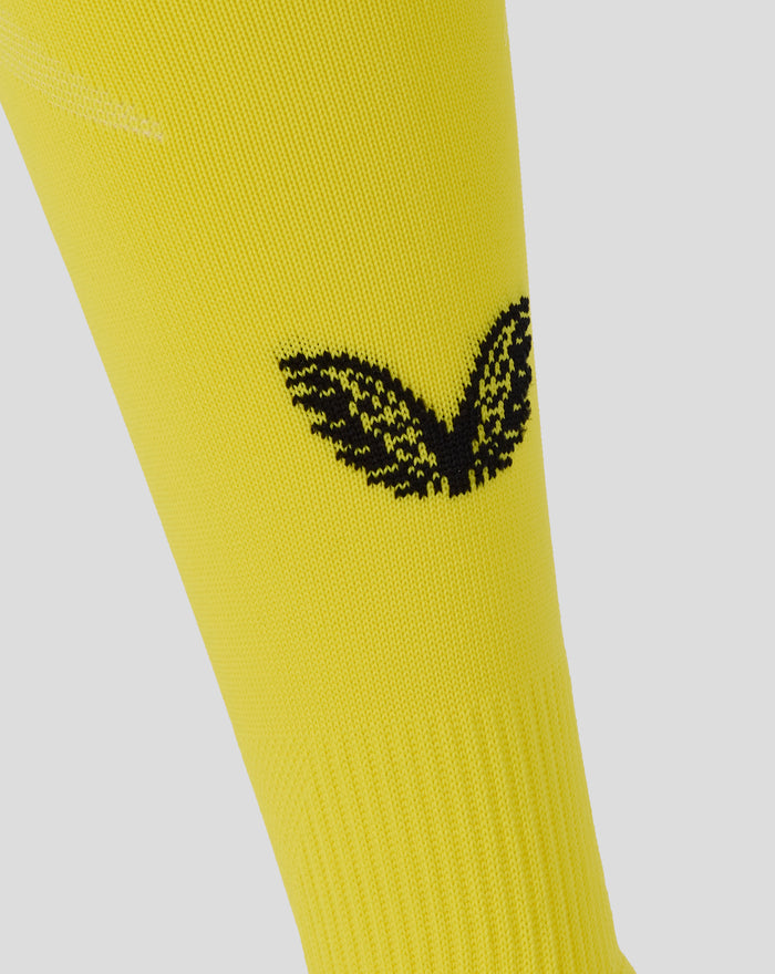 Yellow Feyenoord home goalkeeper sock midsection with a bold black logo pattern