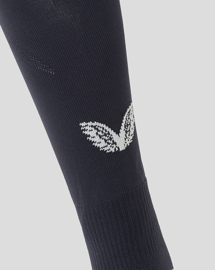 Navy Feyenoord outkousen close-up showing Castore logo on the calf and the F on the shin