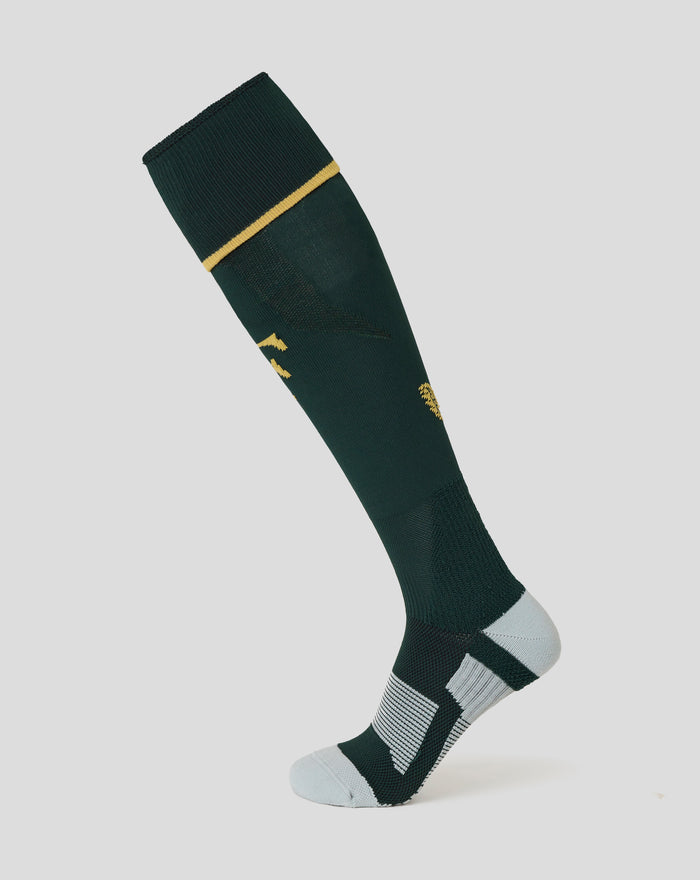Dark green knee-high sock with a gold stripe at the cuff and Castore branding, part of Het Twaalfde Shirt kit
