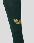 Calf area of dark green sock with gold wing crest and visible knit pattern