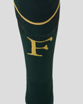 Close-up of dark green sock showing a gold F on the shin and a gold wing emblem on the calf