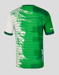 Back view of a Feyenoord x Castore Rotterdam Marathon shirt in green with abstract pattern and subtle skyline