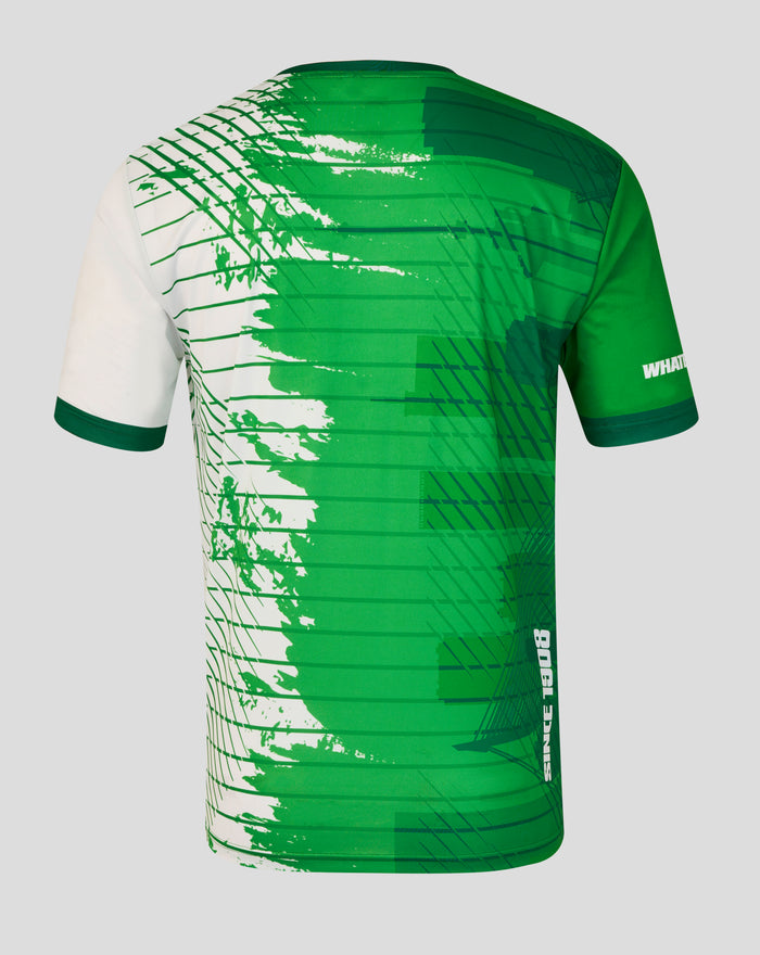 Back view of a Feyenoord x Castore Rotterdam Marathon shirt in green with abstract pattern and subtle skyline