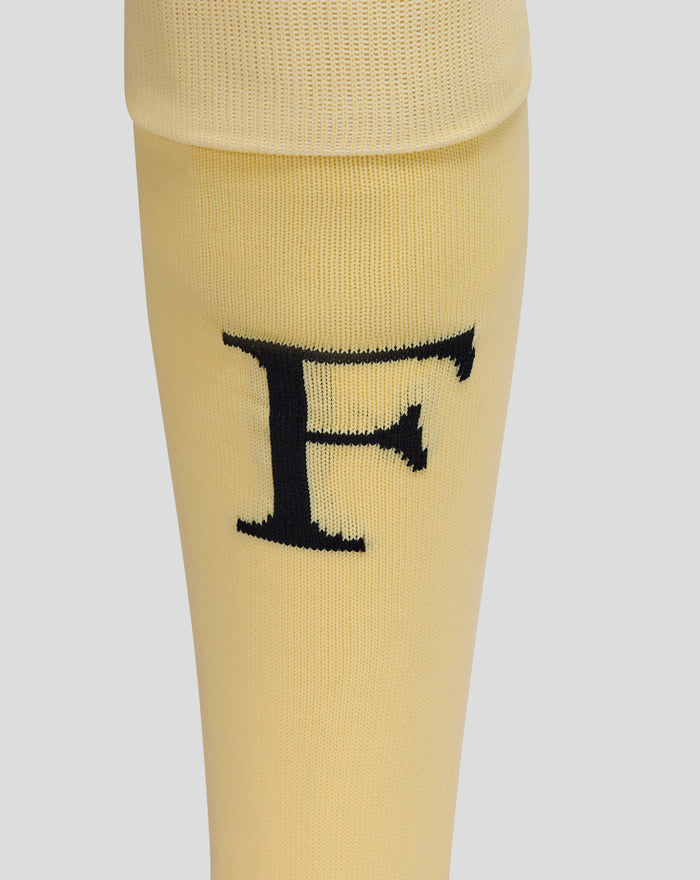 Close up of yellow Feyenoord Vierde socks with a padded heel and Castore logo on the calf