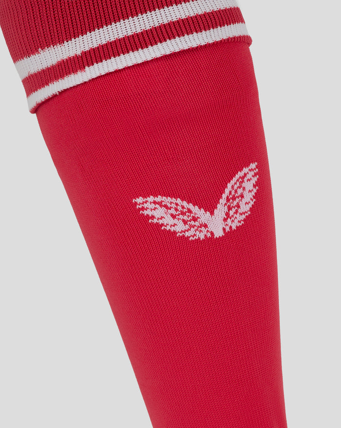 Lower leg view of red Feyenoord keeper sock with white stripes and logo near the ankle