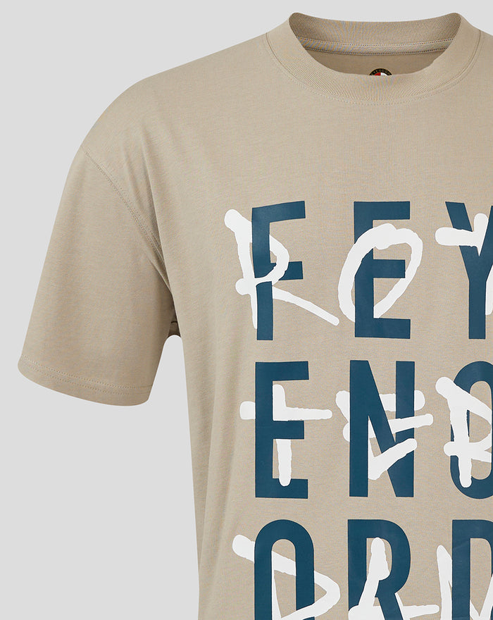 Partial front view of beige adult FEYENOORD contemporary T shirt with oversized navy block lettering.